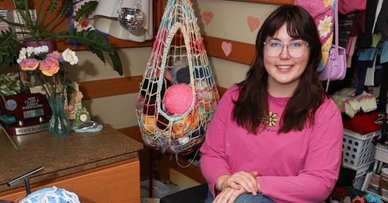 UNK junior Julia McKlem started crocheting about two years ago, adding another craft to the list of artsy activities she enjoys. The K-12 art education major has since created a crochet club on campus, bringing together students who share similar interests. (Photo by Erika Pritchard, UNK Communications)