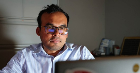 Nipuna Chamara, research assistant professor in biological systems engineering, works on his computer, reviewing the prompts he used with artificial intelligence to win a category of the 2025 TAPS competition. (Russell Shaffer/IANR Communications)