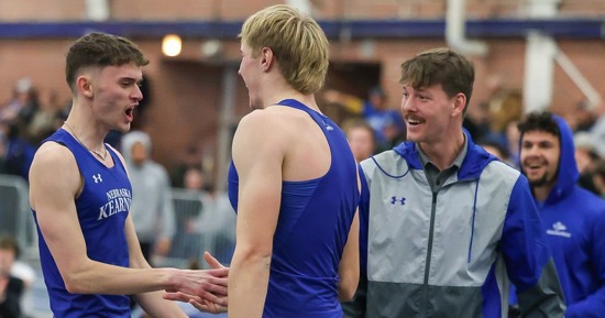 From left, UNK high jumpers Nolan Studley and Luke Brachle celebrate with assistant coach Brayden Sorensen during a meet at Cushing Coliseum on campus. (Photo by Erika Pritchard, UNK Communications)