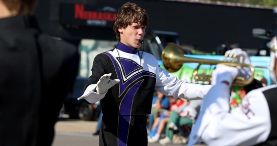 Cael Wiegert Drum Major leading the GISH Marching Band at Harvest of Harmony 2025